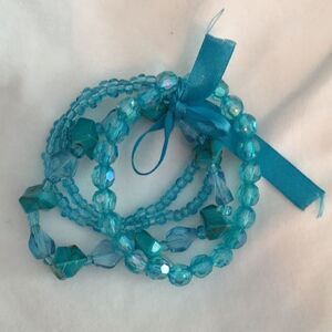 4 bracelets tied together w/ matching satin ribbon